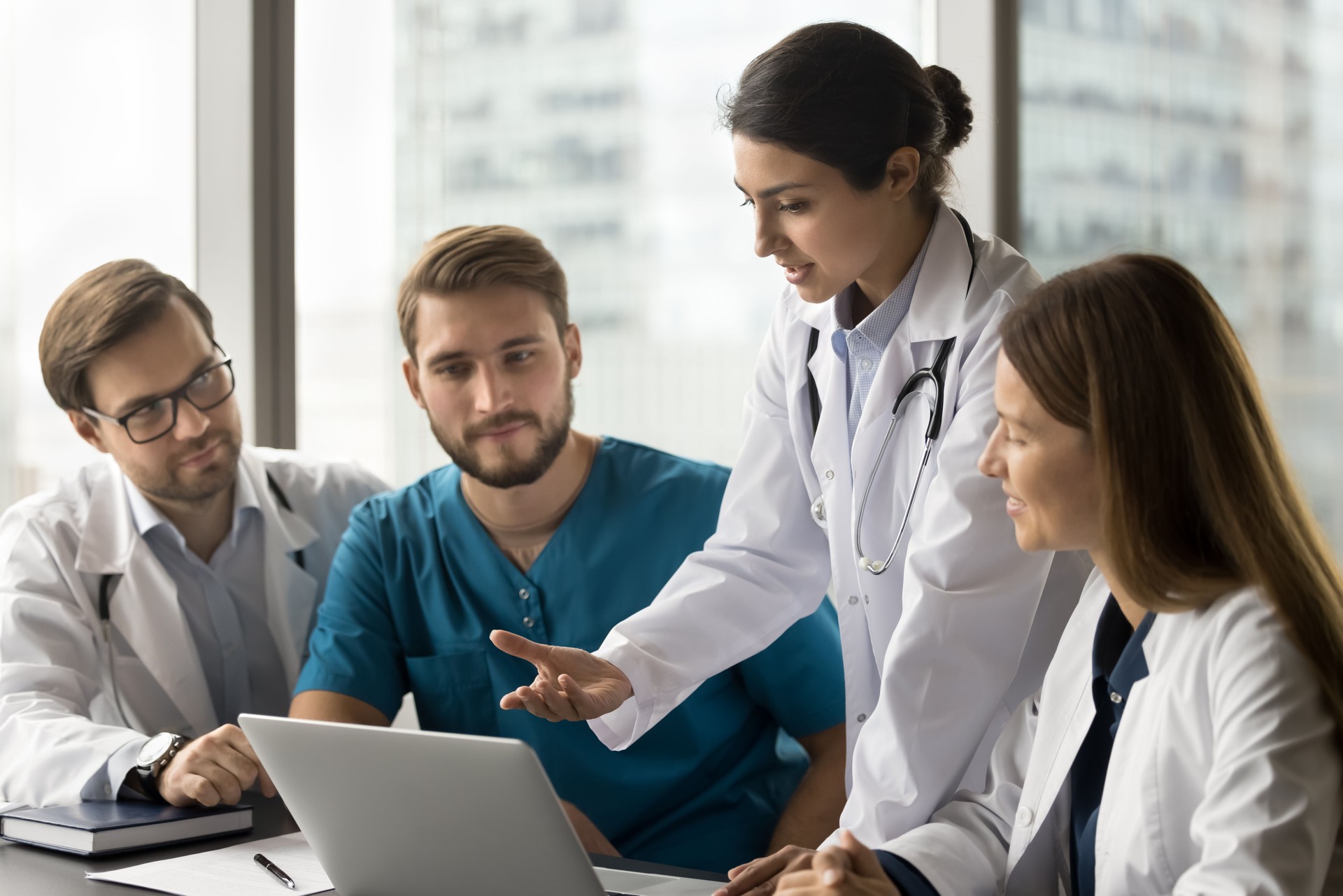 Young Indian doctor woman showing online service for practitioners